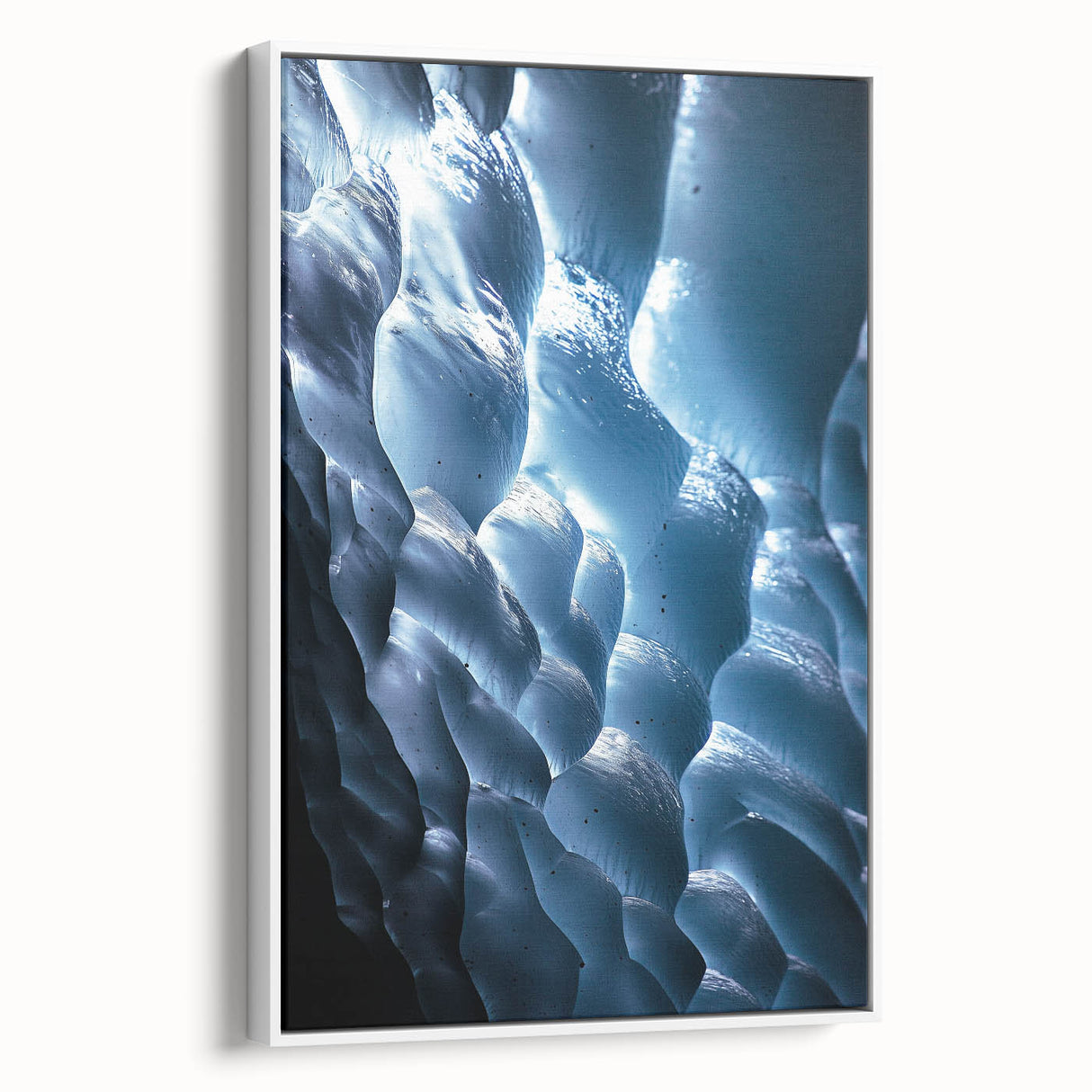 Framed canvas art showcasing a stunning landscape with caves, featuring earthy tones and intricate details, displayed against a white wall, perfect for home decor.