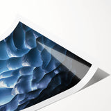 Rolled print showcasing a stunning landscape scene with intricate cave formations and vibrant colors, elegantly packaged in a protective tube for display.