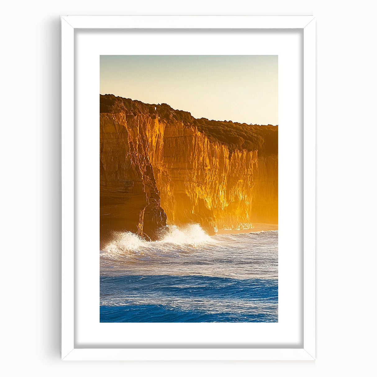 Framed landscape artwork depicting dramatic cliffs and a serene sky, featuring a white mat that enhances the visual appeal, ideal for home decor.