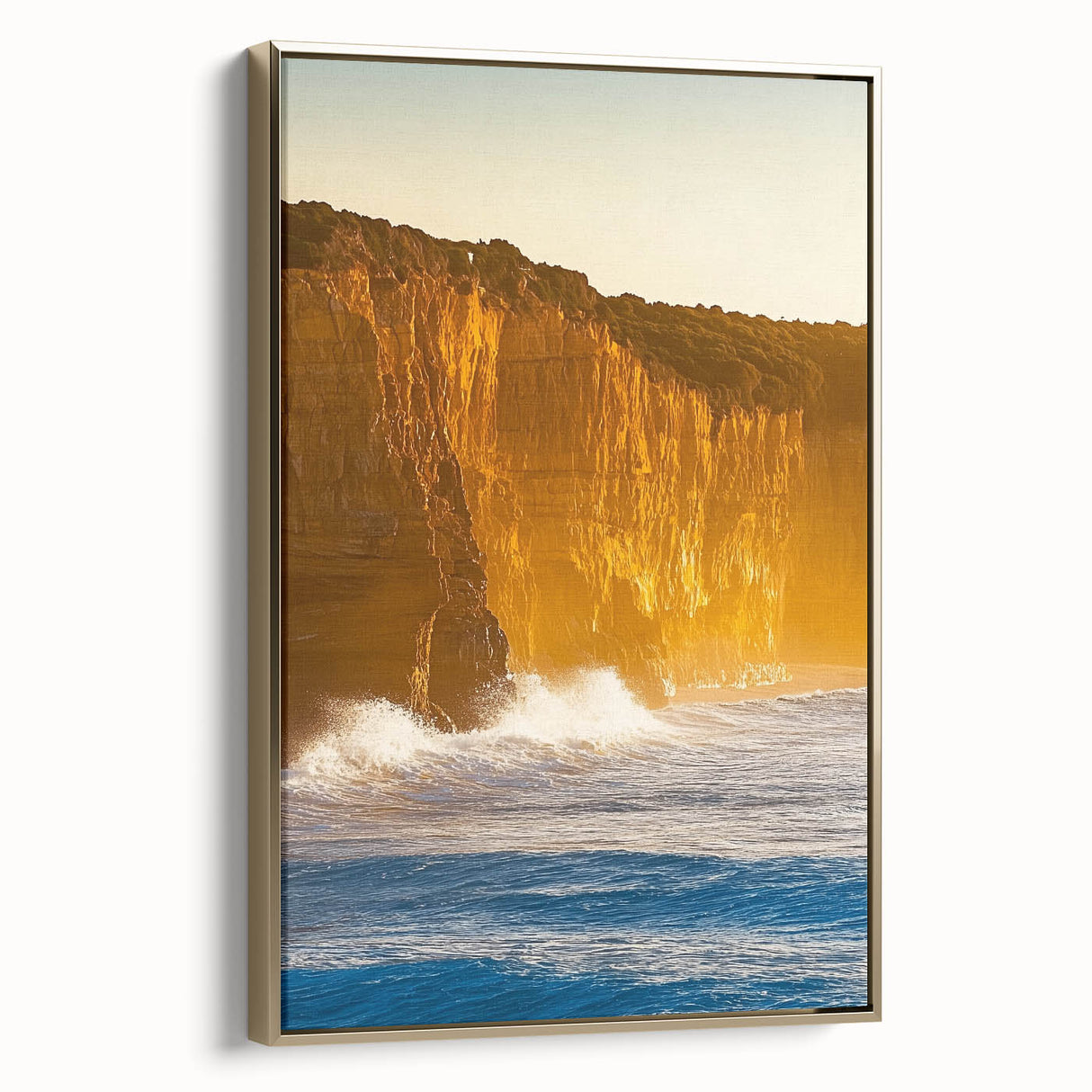 Framed canvas artwork showcasing a scenic landscape of dramatic cliffs, elegantly bordered in gold, perfect for enhancing modern home decor with a touch of nature.
