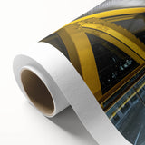 Rolled canvas showcasing a vibrant landscape bridge design, featuring rich colors and intricate details, packaged securely in a durable cardboard tube for safe transport.