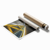 Rolled canvas print showcasing a stunning landscape of a bridge over a serene waterway, featuring vibrant colors and intricate details, packaged securely in a protective tube.