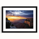 Framed landscape artwork showcasing stunning canyons in deep, rich colors, featuring a sleek black mat and stylish frame, perfect for enhancing home décor.