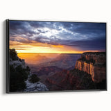 Framed canvas artwork showcasing a stunning landscape of canyons, featuring rich earthy tones and intricate details, presented in a sleek black frame, ideal for enhancing any living space decor.