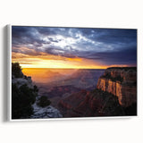 Framed landscape canvas artwork depicting colorful canyons with vibrant hues and intricate details, viewed from the side against a white backdrop, ideal for home decor.