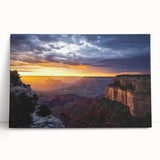 Stretched canvas artwork depicting a stunning landscape of canyons in warm earth tones, ideal for enhancing home decor with a nature-inspired aesthetic.