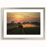 Silver-framed countryside landscape art print featuring vibrant green fields and a clear blue sky, elegantly matted for a refined display in any home decor.