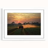 Framed landscape artwork showcasing a serene countryside scene with lush greenery and a clear blue sky, presented in a white mat for an elegant finish. Perfect for home decor enthusiasts seeking a calming nature aesthetic.