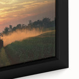 Close-up of a beautifully framed landscape canvas showcasing a serene countryside scene, featuring vibrant greens and soft blue skies, perfect for home decor.