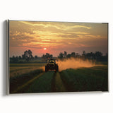 Framed canvas artwork depicting a serene countryside landscape with vibrant green fields and a clear blue sky, showcasing silver framing for an elegant touch. Ideal for home decor.