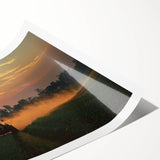 Rolled landscape art print depicting a serene countryside scene with vibrant green fields and a clear blue sky, packaged securely in a protective tube for shipping.