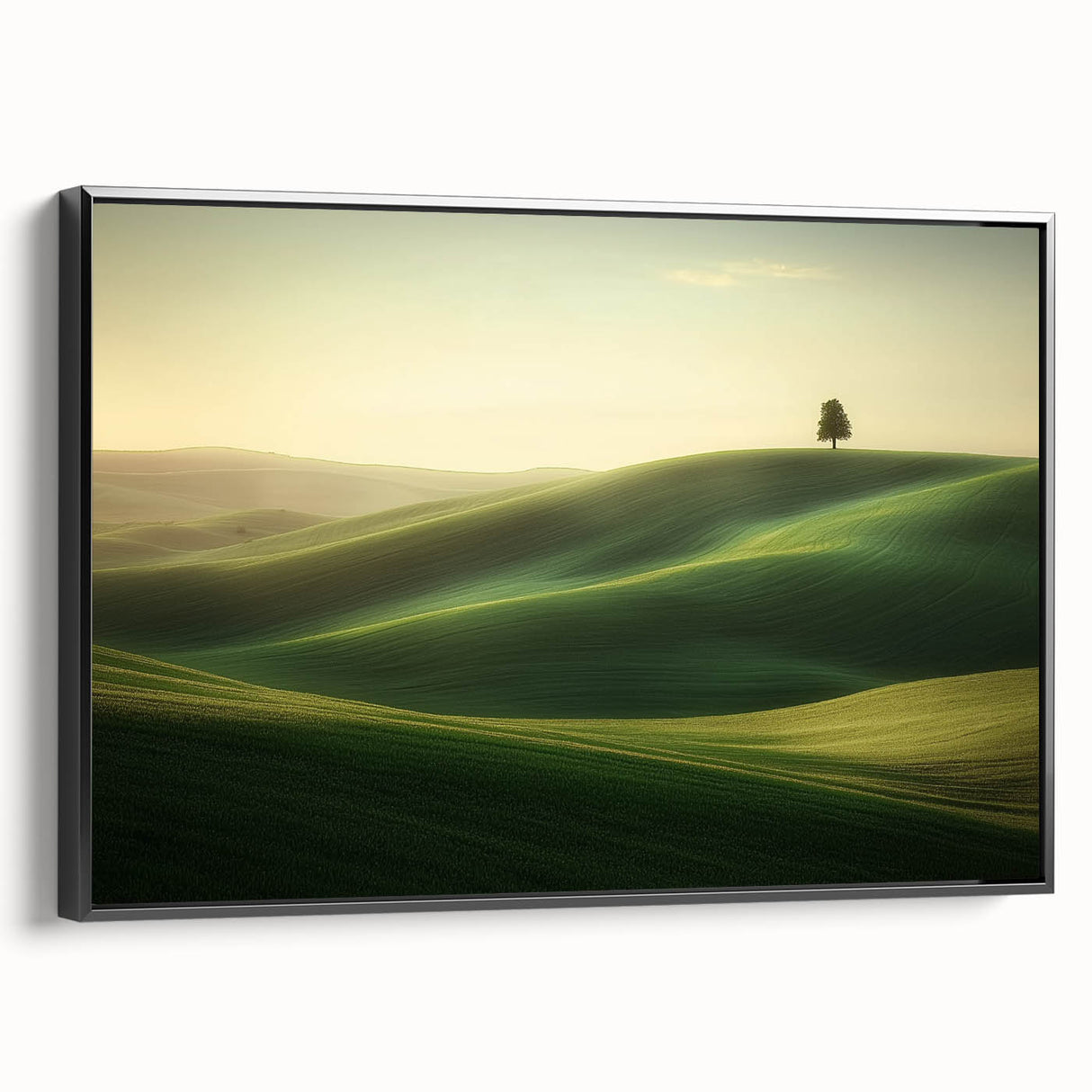 Framed canvas artwork depicting a serene landscape of lush green fields under a blue sky, showcased in a sleek black frame, perfect for home decor and wall art enthusiasts.