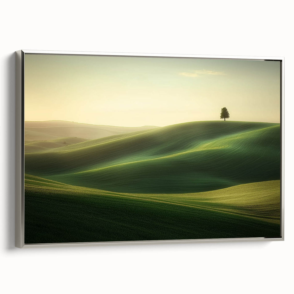 Framed canvas artwork depicting vibrant green fields under a bright blue sky, accented with a sleek silver frame, ideal for home decor or art collections.