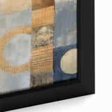 Close-up of framed canvas wall art featuring vibrant abstract strokes in shades of blue, gold, and white, enhancing modern interior decor with a stylish touch. Ideal for contemporary spaces, this artwork adds a dynamic visual element to any room.