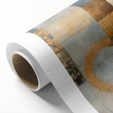 Abstract wall art featuring vibrant strokes in shades of blue, pink, and gold, designed for modern decor, rolled into a protective cardboard tube for shipping.