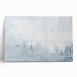 Abstract strokes wall art on stretched canvas, featuring vibrant colors of blue, orange, and white, elegantly leaning against a neutral backdrop, perfect for modern decor.