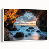 Framed canvas artwork depicting a serene landscape scene with caves, featuring a white frame and side view showcasing its elegant design. Perfect for home decor.