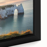 Close-up of a framed canvas artwork depicting a dramatic landscape with rugged cliffs, vivid colors, and intricate details, ideal for home decor and art enthusiasts.