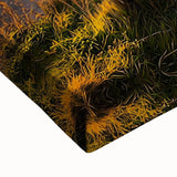 Close-up of a stretched canvas artwork depicting dramatic cliffs and landscapes, showcasing rich earth tones and intricate textures, perfect for modern home decor.