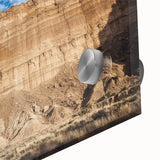 Close-up of an abstract acrylic landscape artwork depicting colorful canyons, showcasing vibrant hues of orange, blue, and yellow, ideal for modern home decor.