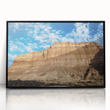 Framed acrylic artwork featuring a stunning landscape of canyons, highlighted by vibrant colors and intricate details, set against a sleek black frame, ideal for home decor.