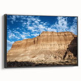 Framed canvas artwork depicting a stunning landscape of canyons, featuring rich earth tones and intricate details, displayed in a sleek black frame for an elegant look. Perfect for home decor enthusiasts seeking nature-inspired art that enhances interior spaces.