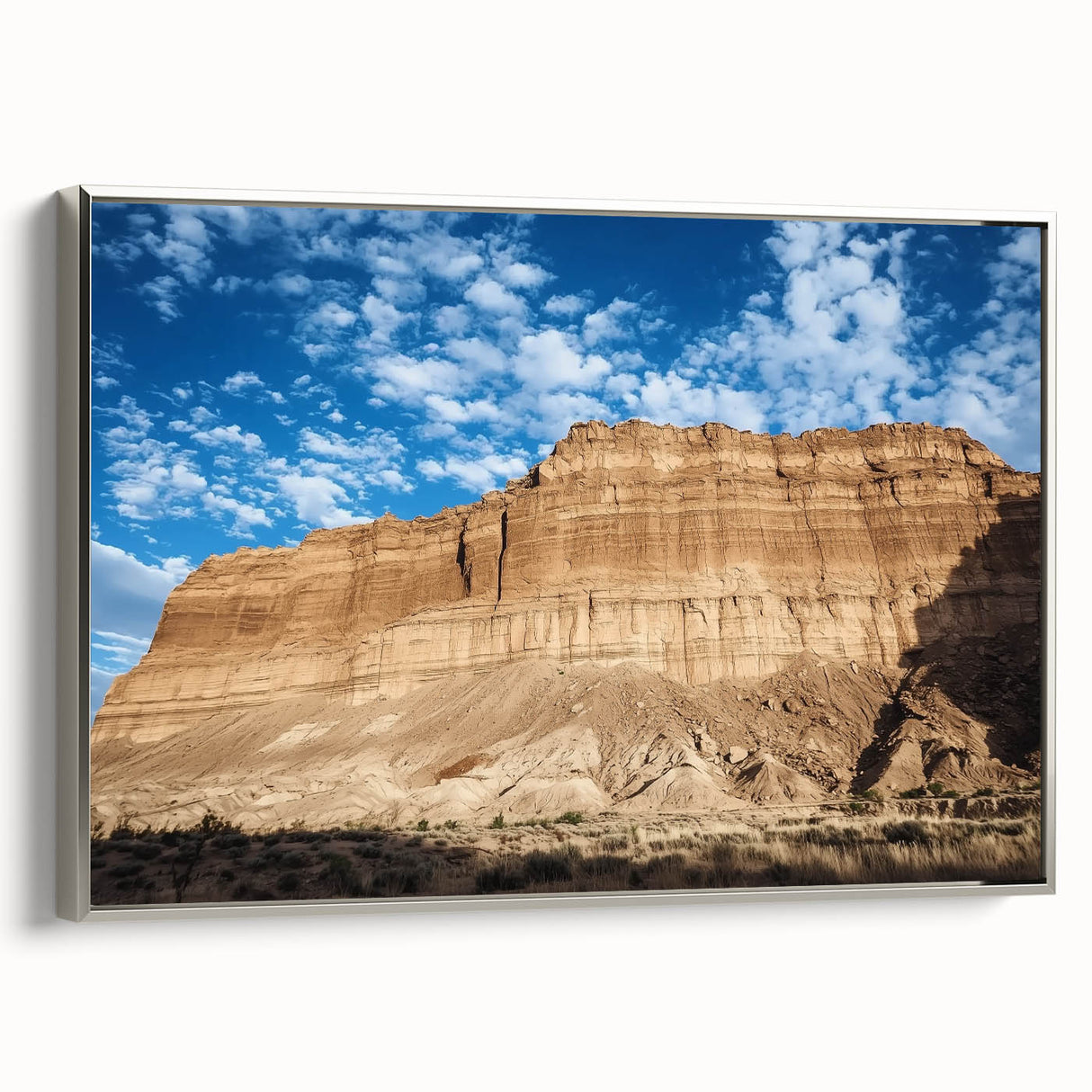 Framed canvas artwork showcasing a breathtaking landscape of canyons with a silver frame, perfect for home decor and enhancing any living space aesthetic.