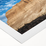 Vibrant rolled canvas depicting a stunning landscape of canyons with rich earthy tones, ideal for home decor, packaged securely for safe delivery.