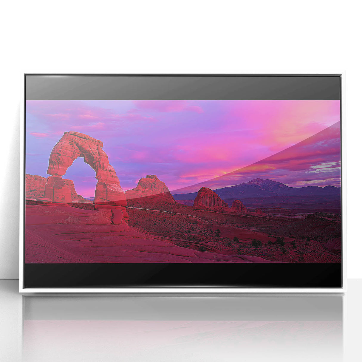 Framed acrylic artwork showcasing a vibrant desert landscape, featuring warm tones of orange and yellow, set in a sleek white frame, perfect for modern decor.