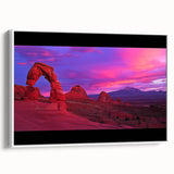 Framed canvas artwork showcasing a vibrant desert landscape with warm hues of orange and yellow, presented in a sleek white frame, ideal for home decor.