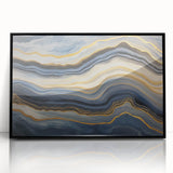 Large abstract wall art featuring swirling blue and green tones on a framed acrylic, ideal for modern living room decor.