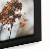 Close-up of a black framed canvas featuring a textured, colorful abstract design, ideal for living room decor.