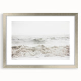 Textured abstract art print in silver frame, featuring dynamic swirls in earthy tones, ideal for modern bedroom decor.