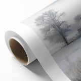 Winter scene with soft snowfall and bare trees in muted cool tones, rolled canvas, suitable as nursery wall art.