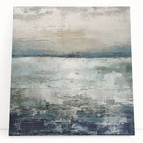 Abstract strokes wall art on stretched canvas featuring vibrant colors of blue, orange, and white, leaning against a neutral wall, perfect for modern home decor.