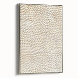 Framed canvas wall art showcasing abstract silver strokes on a textured background, elegantly displayed in a sleek silver frame, perfect for modern decor.