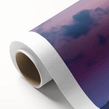 Rolled canvas artwork depicting a serene landscape with a majestic castle surrounded by lush greenery, featuring vibrant colors and intricate details, packaged securely in a cardboard tube.