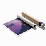 Rolled print showcasing a serene landscape with a majestic castle set against a vibrant sky, elegantly packaged in a protective cardboard tube for shipping.