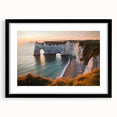 Framed landscape artwork depicting dramatic cliffs with a black mat, showcasing vibrant colors and intricate details, perfect for home decor enhancement.