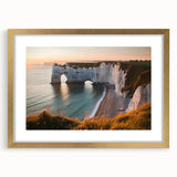 Framed landscape artwork showcasing dramatic cliffs under a vibrant sunset, bordered with a gold mat. Perfect for enhancing home decor in living spaces.