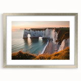 Elegant silver-framed landscape artwork showcasing dramatic cliffs, meticulously matted for a polished presentation, ideal for enhancing modern home decor.