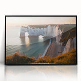 Framed acrylic artwork showcasing a stunning landscape with dramatic cliffs and vibrant colors, set in a sleek black frame, perfect for modern home decor.