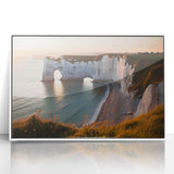 Framed acrylic artwork depicting dramatic cliffs and serene landscapes, featuring vibrant colors and intricate details, perfect for enhancing modern home decor.