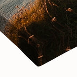 Close-up of a stretched canvas depicting vibrant rocky cliffs and lush greenery, showcasing intricate details and rich colors, ideal for nature-themed decor.