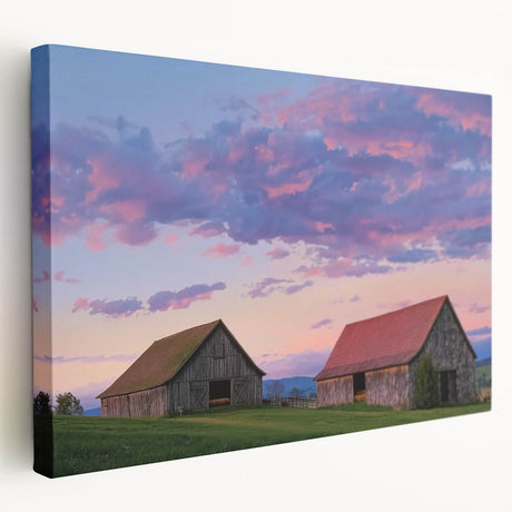 Stretched canvas artwork depicting a serene landscape with a rustic barn, vibrant green fields, and a clear blue sky, perfect for home decor enthusiasts.