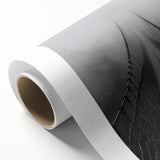 Rolled canvas showcasing a vibrant landscape bridge design with lush greenery and a serene water body, elegantly packaged in a protective cardboard tube for safe shipping.