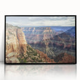 Framed acrylic artwork depicting a stunning landscape of canyons, featuring rich earth tones and dramatic rock formations, set against a sleek black frame. Perfect for nature lovers and home decor enthusiasts seeking a modern touch.