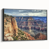 Framed canvas artwork depicting a stunning landscape of canyons, showcasing vibrant colors and intricate details, set against a sleek black frame, ideal for home decor.