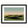 Black-framed landscape artwork showcasing a serene countryside scene, featuring vibrant green fields and a clear blue sky, perfect for home decor.