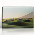 Framed acrylic landscape artwork showcasing a serene countryside scene, featuring vibrant green fields and a clear blue sky, elegantly displayed with a sleek black frame.